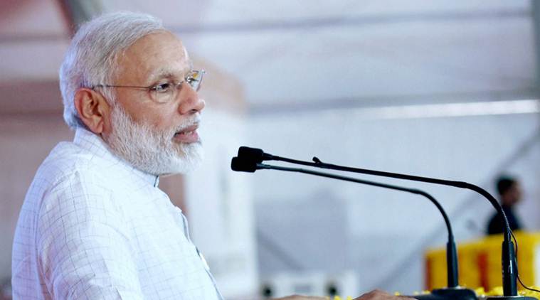 Gandhidham: Prime Minister Narendra Modi addressing at the foundation stone laying of Development of 14th and 16th General Cargo Berth of Kandla Port, in Gandhidham, Gujarat on Monday. PTI Photo / PIB (PTI5_22_2017_000154B) *** Local Caption ***
